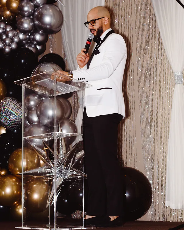 Speaker addressing guests at a celebration