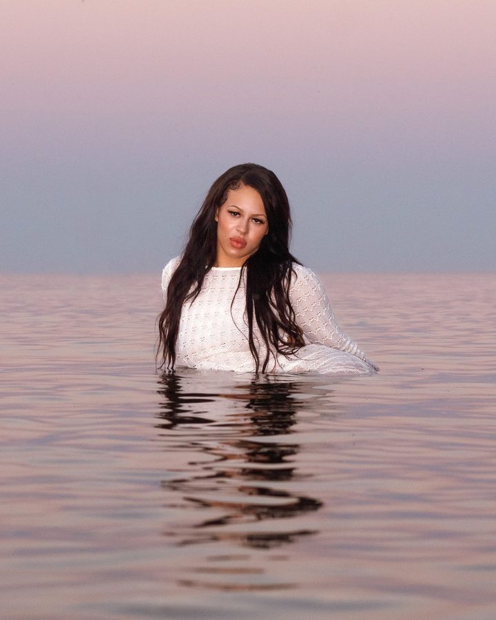 Portrait of a woman standing in shallow water